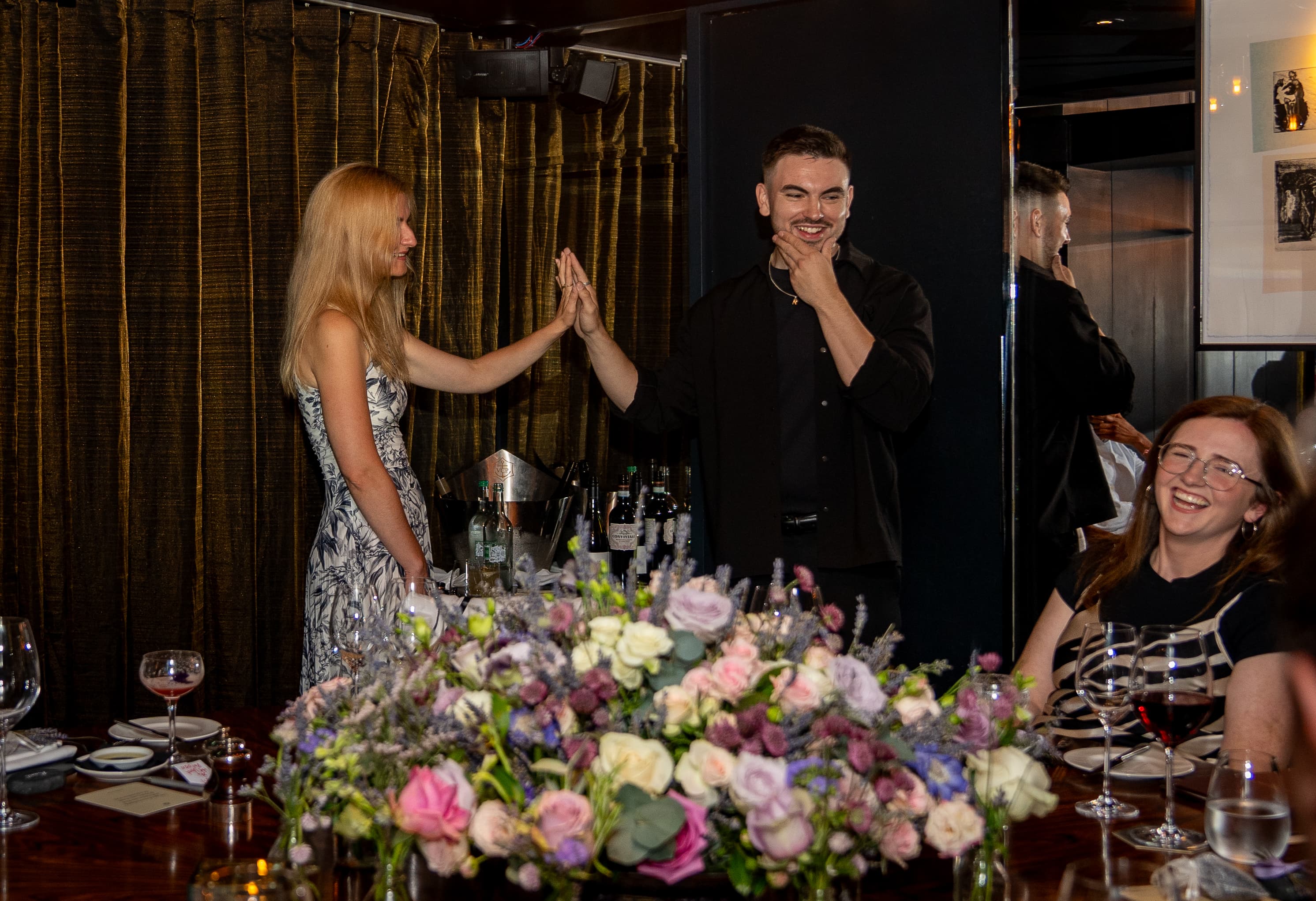 Edwin sharing a moment with a guest at a corporate event
