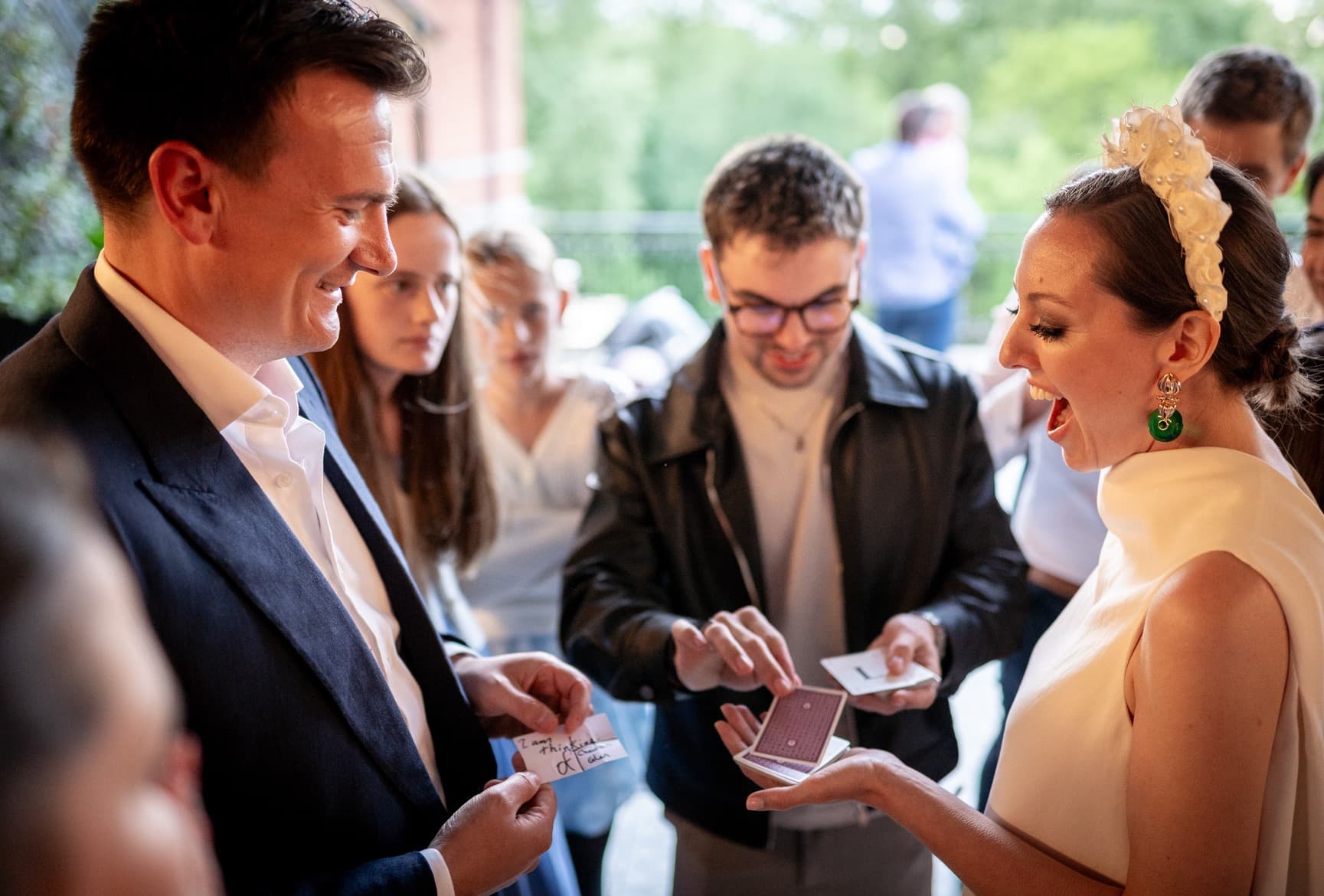 A bride reacting with delight during a close-up mentalism moment with Edwin